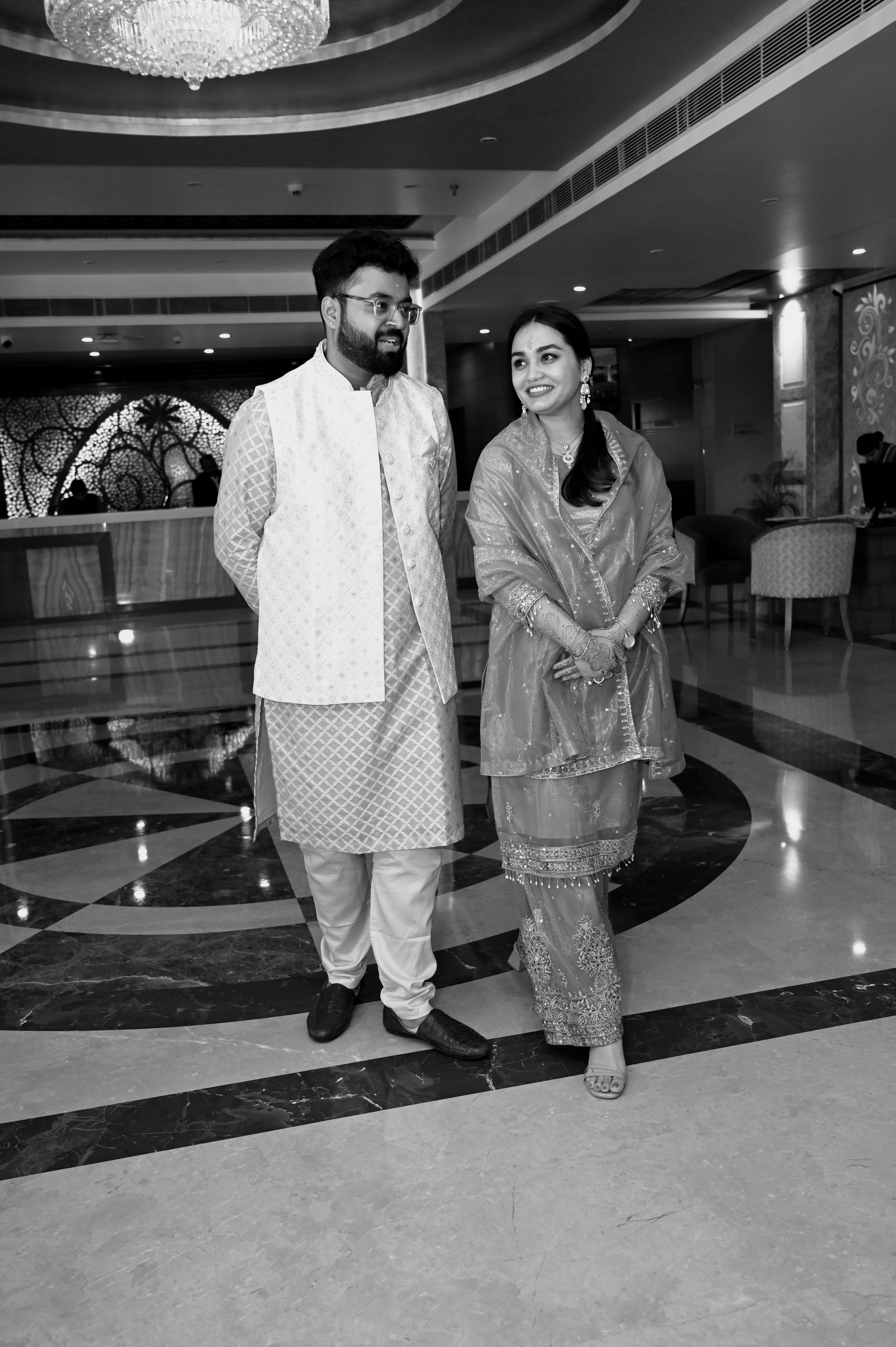 Srijan and Rashmi smiling together in a black and white photograph